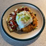A fried egg, crushed seaweed paper, green onions and sesame seeds top this classic Korean kimchi dish. (Photo by Tress Dale/Peninsula Clarion)