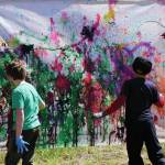 Children help create art with the projectile painting booth on Saturday, June 5, 2021, for Mary Epperson Day at the Homer Council on the Arts in Homer, Alaska. (Photo by Michael Armstrong/Homer News0