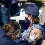 Grace Withers receives her second COVID-19 vaccine during the pop-up clinic on the Spit May 27. (Photo by Sarah Knapp/Homer News)