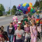 People march in a combined Pride and Juneteenth event on Saturday, June 19, 2021, along Pioneer Avenue in Homer, Alaska. (Photo by Michael Armstrong/Homer News)