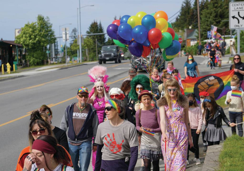 People march in a combined Pride and Juneteenth event on Saturday, June 19, 2021, along Pioneer Avenue in Homer, Alaska. (Photo by Michael Armstrong/Homer News)