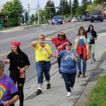 People march in a combined Pride and Juneteenth event on Saturday, June 19, 2021, along Pioneer Avenue in Homer, Alaska. (Photo by Michael Armstrong/Homer News)