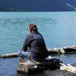 Homer News editor Michael Armstrong contemplates the icy waters of Kenai Lake on Saturday, June 12, 2021, at the Trail River Campground near Seward, Alaska. (Photo by Jennifer Stroyeck)