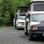 Two vintage VW campers are seen on Thursday, June 10, 2021, at the Trail River Campground near Seward, Alaska. (Photo by Michael Armstrong/Homer News)