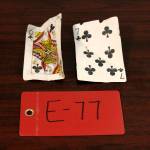 Two playing cards recovered from the 1952 crash of a C-124 Globemaster were found this month on Colony Glacier and displayed at Joint Base Elmendorf-Richardson, Alaska, Tuesday, Sept. 29, 2021. The plane slammed into a mountain, killing 52 on board, and the plane and its crew have since become part of the glacier. The military has conducted annual summer recovery efforts, finding human remains and personal items on the glacier. (AP Photo/Mark Thiessen)