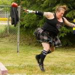 An athlete competes in the womens heavy weight competition at the 2021 Kachemak Bay Highland Games on Saturday, July 3. (Photo by Sarah Knapp/Homer News)