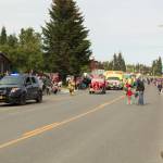 The Homer Police and Fire Departments led the 2021 Whatever Floats Your Boat Fourth of July Parade down Pioneer Avenue on Sunday, July 4. Police officers and firefighters passed out candy to Homer community members lining the sidewalks. (Photo by Sarah Knapp/Homer News)