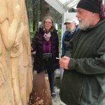 Sara Berg, left, and Ed Berg, center, talk with artist Brad Hughes, right at Hughes Homer, Alaska, studio in June 2021 about the Loved & Lost Memorial Bench project Berg and other family and friends of Anesha Murnane commissioned to honor Murnane and other missing woman and children. (Photo by Christina Whiting)