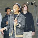 Morgan Baker, center, sings a solo with the rest of the Yale University Whiffenpoofs backing her at a concert Thursday, July 8, 2021, at the Boathouse Pavillion in Homer, Alaska. The group also did a workshop Thursday at the Homer Council on the Arts. (Photo by Michael Armstrong/Homer News)