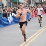 Anchorages Lars Arneson outsprints Dakota Jones of Bozeman, Montana, for sixth place in the mens Mount Marathon Race on Wednesday, July 7, 2021, in Seward, Alaska. (Photo by Jeff Helminiak/Peninsula Clarion)