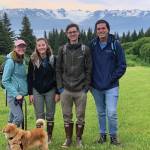 From left to right, Ashley Laukhuf, Kristin Armstrong, Nick Hansen and Kyle Barnes pose for a photo earlier this month on Inspiration Ridge Preserve near Homer, Alaska. The graduate students with the University of Michigan, Ann Arbor, were doing research with the School for Environment and Sustainability. (Photo by Nina Faust)