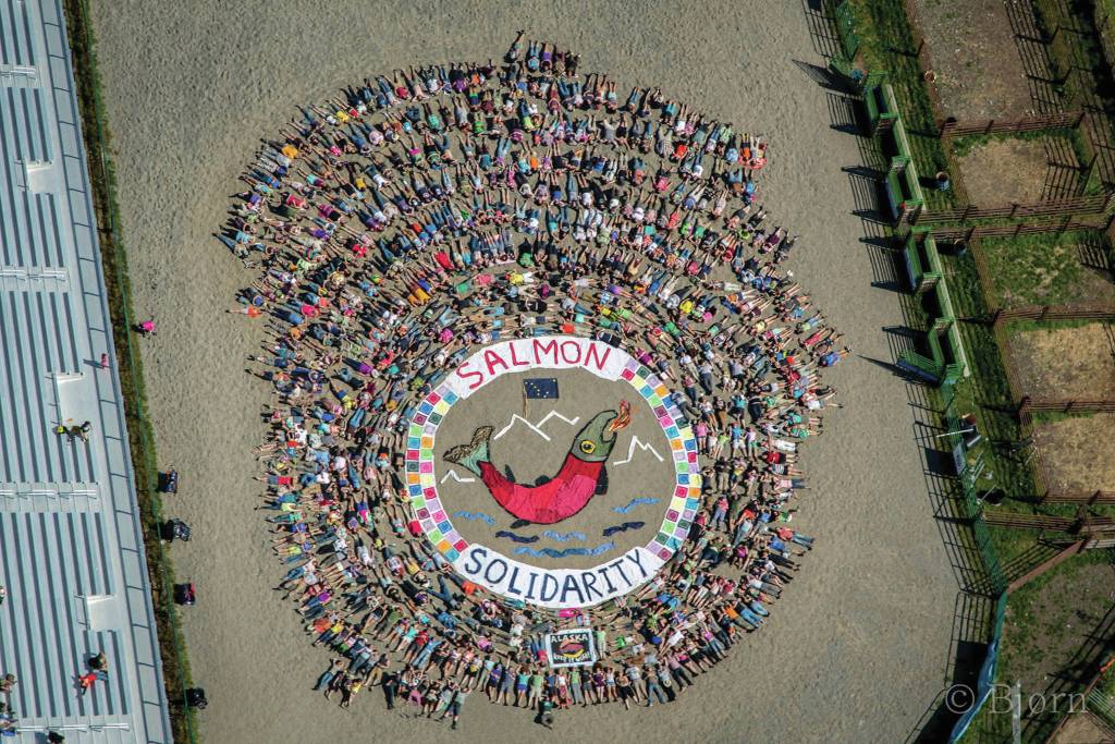 SalmonSolidarity, an aerial art action organized by Mavis Muller, was held Aug. 2, 2014, in the Rodeo arena of the Kenai Peninsula Fairgrounds at Salmonfest in Ninilchik, Alaska. (Photo by Bjorn Olson and courtesy of Mavis Muller)