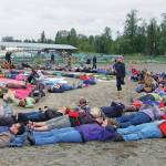 Photo courtesy of Mavis Muller 
Mavis Muller, center, with bull horn, arranged 2011 Salmonfest attendees for an aerial art event in the rodeo arena at Kenai Peninsula Fairgrounds near Ninilchik, Alaska.