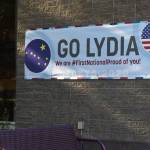 A banner supporting Olympic swimmer Lydia Jacoby hangs outside of First National Bank Alaska in her hometown of Seward on Saturday, July 24, 2021. (Camille Botello / Peninsula Clarion)