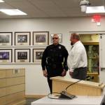 Soldotna Police Department Officer Victor Dillon speaks with KPBSD Director of Secondary Education Tony Graham at the George A. Navarre Borough Admin building on Monday, August 2, 2021 in Soldotna, Alaska. (Ashlyn O'Hara/Peninsula Clarion)