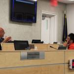 Board members Jason Tauriainen and Matt Morse discuss the COVID-19 vaccine during a break at a meeting of the KPBSD Board of Education on Monday, August 2, 2021 in Soldotna, Alaska. (Ashlyn O'Hara/Peninsula Clarion)