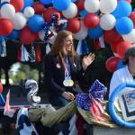Olympic gold medalist Lydia Jacoby waves to the crowd in Seward during her celebratory parade on Thursday, August 5, 2021. (Camille Botello / Peninsula Clarion)