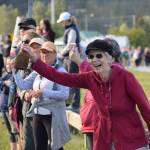 The crowd cheers as Olympic gold medalist Lydia Jacoby passes through Seward during her celebratory parade on Thursday, August 5, 2021. (Camille Botello / Peninsula Clarion)