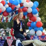 Olympic gold medalist Lydia Jacoby waves to the crowd in Seward during her celebratory parade on Thursday, August 5, 2021. (Camille Botello / Peninsula Clarion)