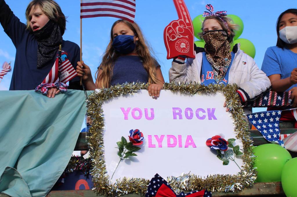 Kids hold a sign cheering on 17-year-old Lydia Jacoby, who earned a gold and silver medal in the 2020 Olympics in Tokyo, Japan, on Thursday, Aug. 5, 2021. (Photo by Ashlyn OHara/Peninsula Clarion)