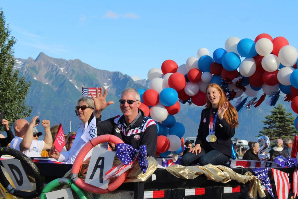 Olympic gold medalist Lydia Jacoby waves to the crowd in Seward during her celebratory parade on Thursday, August 5, 2021. (Ashlyn O'Hara/Peninsula Clarion)