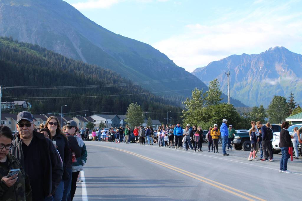 People line up to watch Olympic gold medalist Lydia Jacoby pass through Seward during her celebratory parade on Thursday, August 5, 2021. (Ashlyn OHara/Peninsula Clarion)