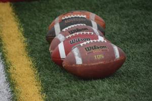 A row of footballs iat the Homer-Seward game at Homer, Alaska, on Aug. 29, 2020. (Photo by Michael Armstrong/Homer News)