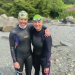 Photo by Cassidy Carroll Jessie Goodrich, left, and Lauren Kuhns, right, pose on Aug, 8, 2021, after swimming in the Change Your Latitude 10 km open ocean swim in Sitka. Goodrich is a Homer open ocean swimmer and Kuhns is a Homer woman attending Assumption College in Worchester, Massachusetts.