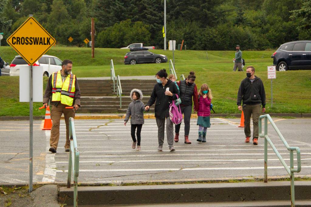 Parents walk their children to their first day of school at Paul Banks Elementary School on Aug. 7, 2021. (Photo by Sarah Knapp/Homer News)