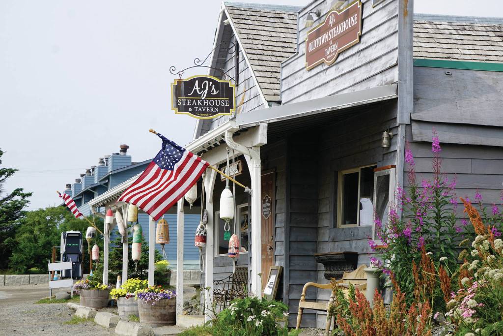 The parking lot at AJs OldTown Steakhouse & Tavern is empty on Monday, Aug. 16, 2021. The Homer, Alaska, restaurant was closed because of a positive COVID-19 test among a staff member, one of many businesses in Homer closed because of COVID-19 concerns. (Photo by Michael Armstrong/Homer News)