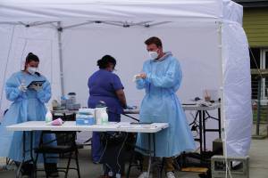 Healthcare workers with Capstone Clinic staff a pop-up COVID-19 testing clinic on Monday, Aug. 16, 2021, at the Homer Public Library in Homer, Alaska. The clinic offers same-day testing from noon-7:30 p.m. today and noon-4 p.m. Friday. (Photo by Michael Armstrong/Homer News).