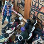 Michael S. Lockett / Juneau Empire
Participants in a ceremony commemorating the settlement of an intellectual property lawsuit against a fashion company take cuttings of the commercial garment at the center of the case on Friday, Aug. 13, 2021.