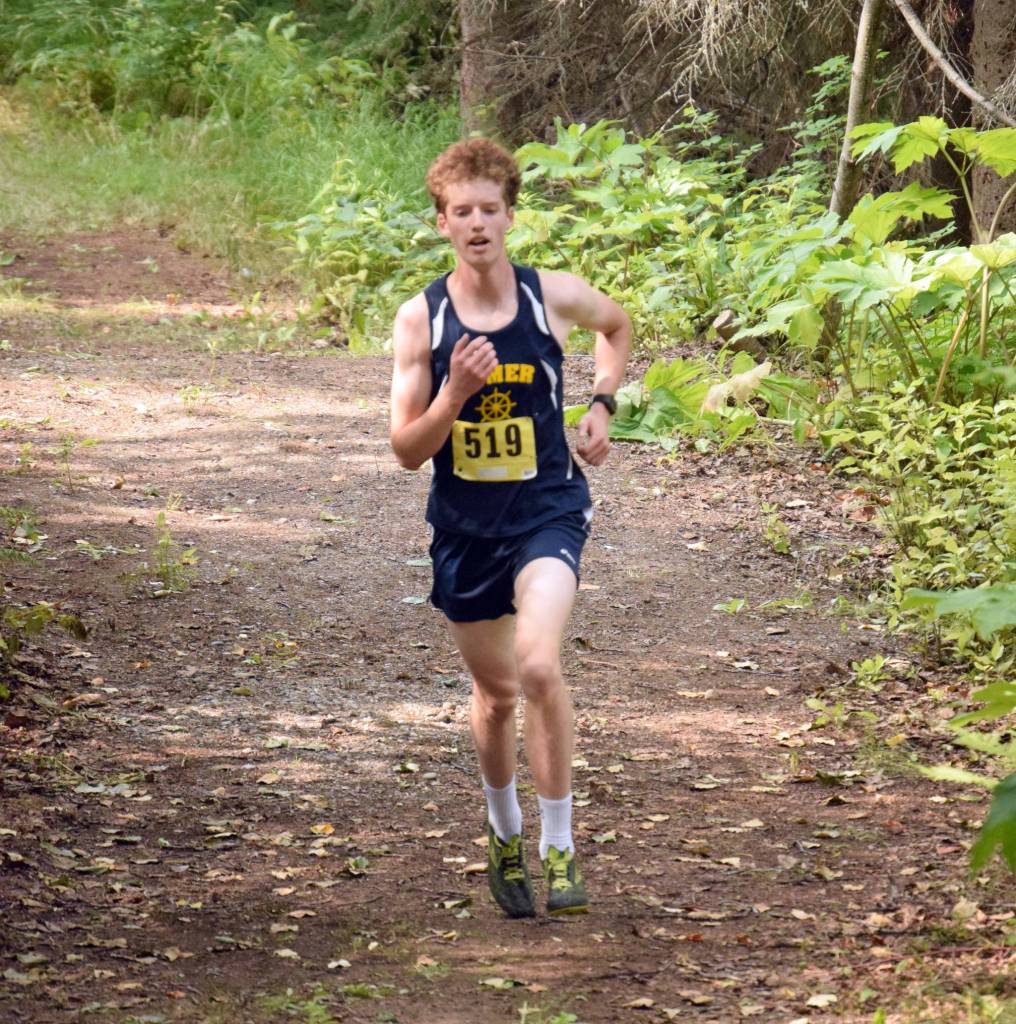 Homer junior Seamus McDonough runs to victory in the junior-senior race at the Nikiski Class Races on Monday, Aug. 16, 2021, at Nikiski High School in Nikiski, Alaska. (Photo by Jeff Helminiak/Peninsula Clarion)