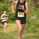 Kenai Central sophomore Emilee Wilson runs to victory in the freshmen-sophomore girls race in the Nikiski Class Races on Monday, Aug. 16, 2021, at Nikiski High School in Nikiski, Alaska. (Photo by Jeff Helminiak/Peninsula Clarion)