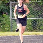 Kenai Central junior Jayna Boonstra runs to victory in the junior-senior girls race at the Nikiski Class Races on Monday, Aug. 16, 2021, at Nikiski High School in Nikiski, Alaska. (Photo by Jeff Helminiak/Peninsula Clarion)