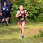 Kenai Central sophomore Jack Laker runs to victory in the freshmen-sophomore boys race at the Nikiski Class Races on Monday, Aug. 16, 2021, at Nikiski High School in Nikiski, Alaska. (Photo by Jeff Helminiak/Peninsula Clarion)