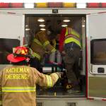 EMTs assess a plane crash victims wounds before transporting them to a medical facility. (Photo by Sarah Knapp/Homer News)