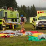 Emergency responders participate in a mass casualty emergency drill at Homer Airport on Tuesday, Aug. 24. The responders were responsible for recovering victims from a mock plane crash, triaging and transporting them to medical facilities. (Photo by Sarah Knapp/Homer News)