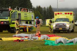 Emergency responders participate in a mass casualty emergency drill at Homer Airport on Tuesday, Aug. 24. The responders were responsible for recovering victims from a mock plane crash, triaging and transporting them to medical facilities. (Photo by Sarah Knapp/Homer News)