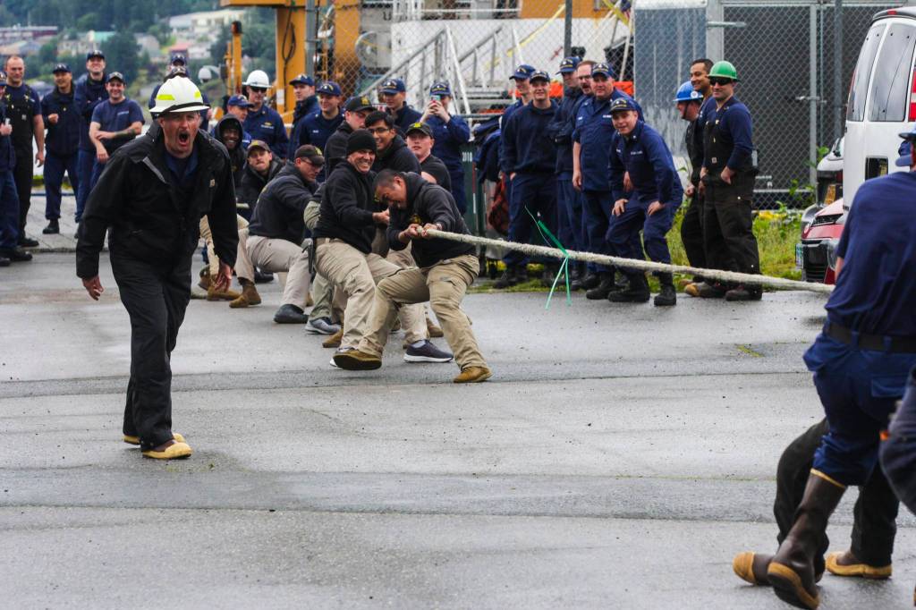 Army divers, in the khaki pants, compete against a team of Coast Guardsmen in the tug of war, one of the inter-vessel competitions during this years Buoy Tender Roundup at Sector Juneau, on Wednesday, Aug. 25, 2021. (Michael S. Lockett / Juneau Empire)