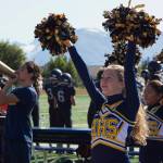 The Homer Mariner cheerleaders pep up the crowd during the Homer vs. Kodiak game Saturday, Aug. 28. The squads cheers could be heard by all as Homer won 34-0. (Photo by Sarah Knapp/Homer News)
