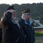 Members of the American Legion Post 16 salute the American flag while Taps is played. (Photo by Sarah Knapp/Homer News)