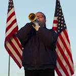 Christie Hill plays Taps during the 9/11 memorial service on Saturday. (Photo by Sarah Knapp/Homer News)