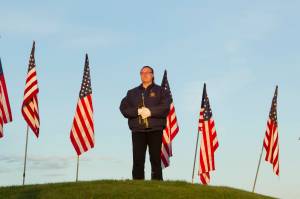 Christie Hill prepares to play Taps during the 9/11 memorial service on Saturday. (Photo by Sarah Knapp/Homer News)