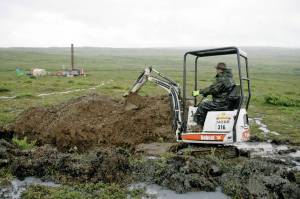 AP Photo / Al Grillo 
A worker with the Pebble Mine project digs in the Bristol Bay region of Alaska near the village of Iliamma, Alaska. The U.S. Environmental Protection Agency announced Thursday, Sept. 9, it would seek to restart a process that could restrict mining in Alaskas Bristol Bay region, which is renowned for its salmon runs. The announcement is the latest in a long-running dispute over a proposed copper-and-gold mine in the southwest Alaska region.