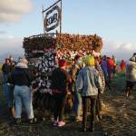 People interact with Recover, the 18th annual Burning Basket, before its ignited on Sunday, Sept. 12, 2021, at Mariner Park on the Homer Spit in Homer, Alaska. (Photo by Michael Armstrong/Homer News)
