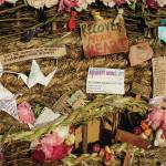 Signs, flowers and origami cranes decorate Recover, the 18th annual Burning Basket, on Sunday, Sept. 12, 2021, at Mariner Park on the Homer Spit in Homer, Alaska. The baskets theme also coincided with National Recovery Month for September. (Photo by Michael Armstrong/Homer News)