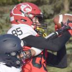 Kenai Central's David Martin catches a touchdown on Homer's Morgen Techie on Friday, Sept. 17, 2021, at Ed Hollier Field in Kenai, Alaska. (Photo by Jeff Helminiak/Peninsula Clarion)