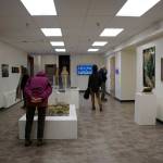 People visit the Homer Drawdown Peatland exhibit last Friday, Sept. 17, 2021, at a reception and talk at the Pratt Museum & Park in Homer, Alaska. (Photo by Michael Armstrong/Homer News)