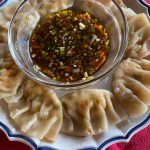 Cooked by a combination of pan frying and steaming, delicate tofu and vegetable dumplings require a delicate hand and patience. (Photo by Tressa Dale/Peninsula Clarion)